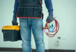 a plumber with his tools