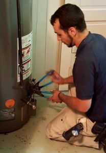 plumber fixing a water heater